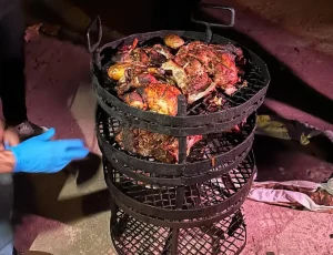 Traditional Bedouin zarb cooking with meat grilled underground at Salem Camp in Wadi Rum.